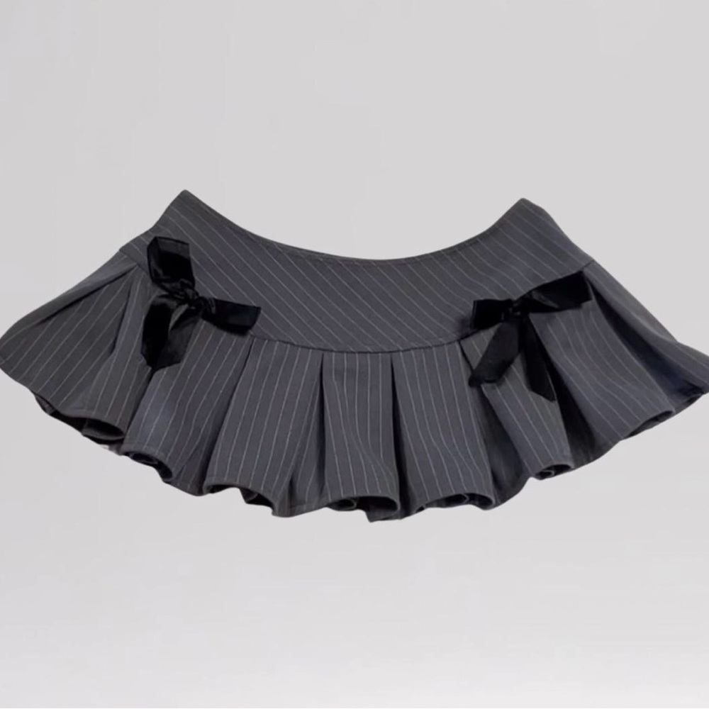 Pleated Skirt w/ Bows
Show off some leg is this adorable pleated pinstripe skirt